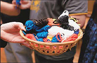 Weavers of the Wheel of Life circulate the yarn.